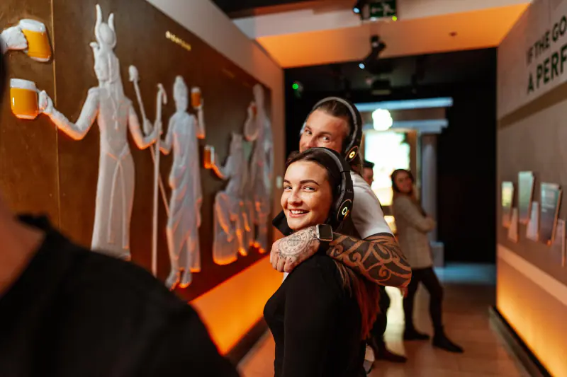 Visitors discovering the interactive Pilsner Urquell exhibition
