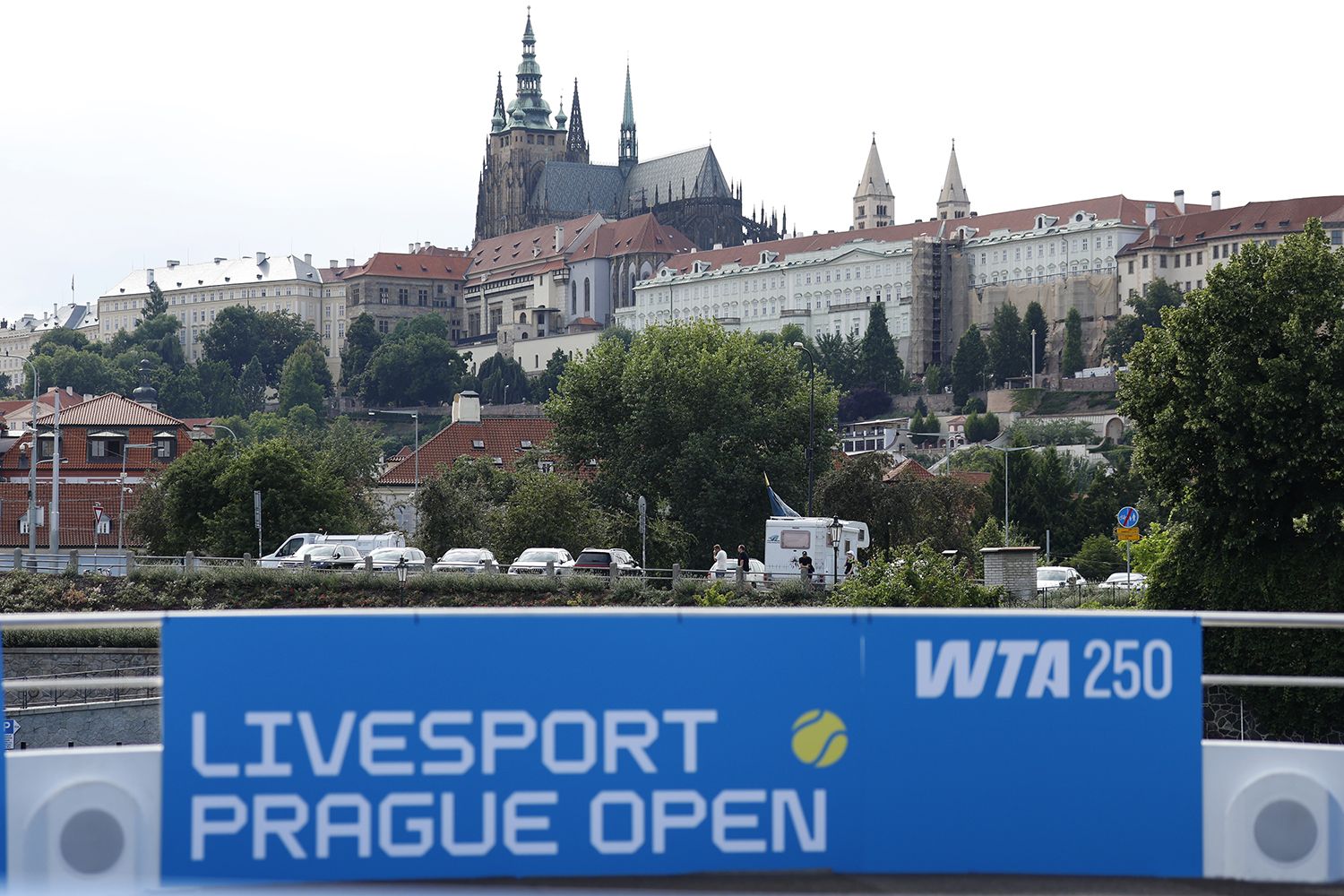 Livesport Prague Open banner on the deck of a boat, Prague Castle behind