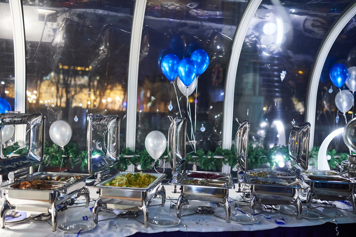 New Year’s Eve buffet aboard the glass boat with balloons