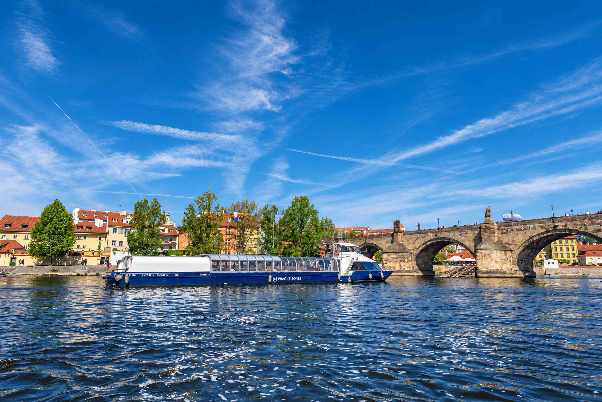 Agnes de Bohemia by Charles Bridge on a sunny day